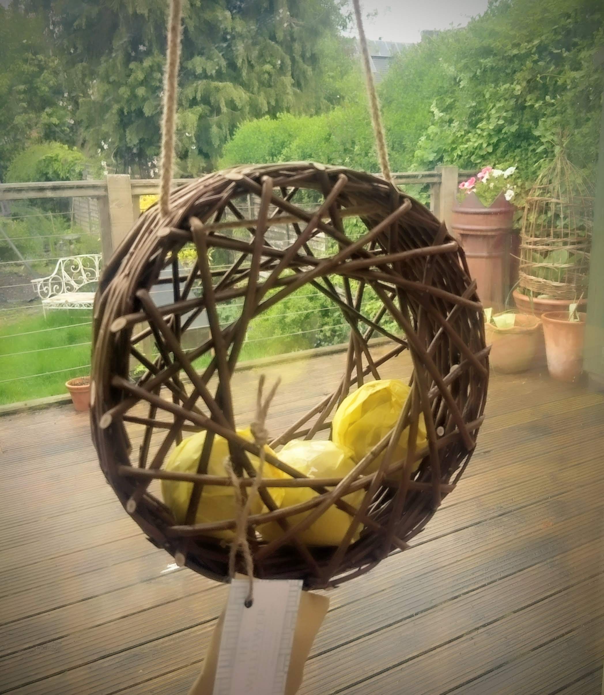 Willow bird feeder, circular, containing 3 suet balls